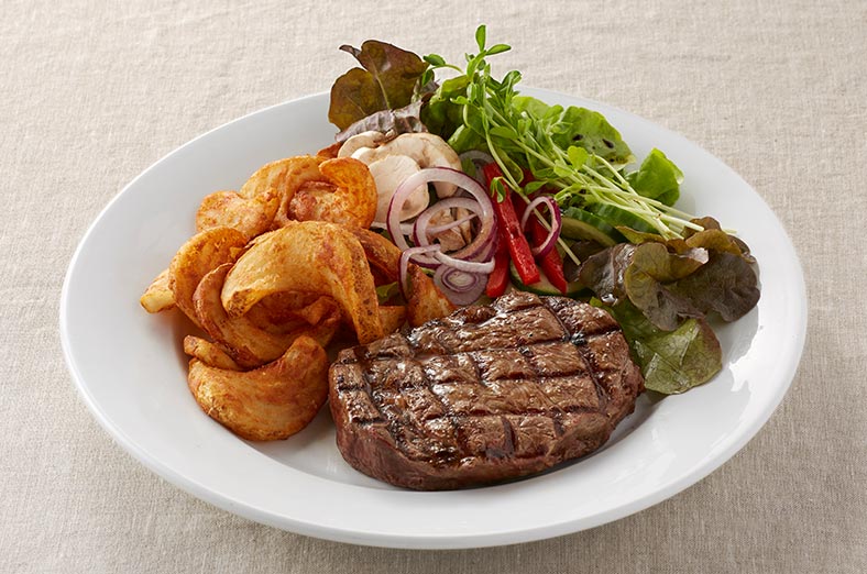 Ribeye steak, fries, salad