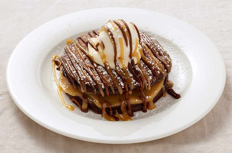 Chocolate pancakes, peanut butter filling, vanilla ice cream, cream, peanut butter sauce, chocolate sauce